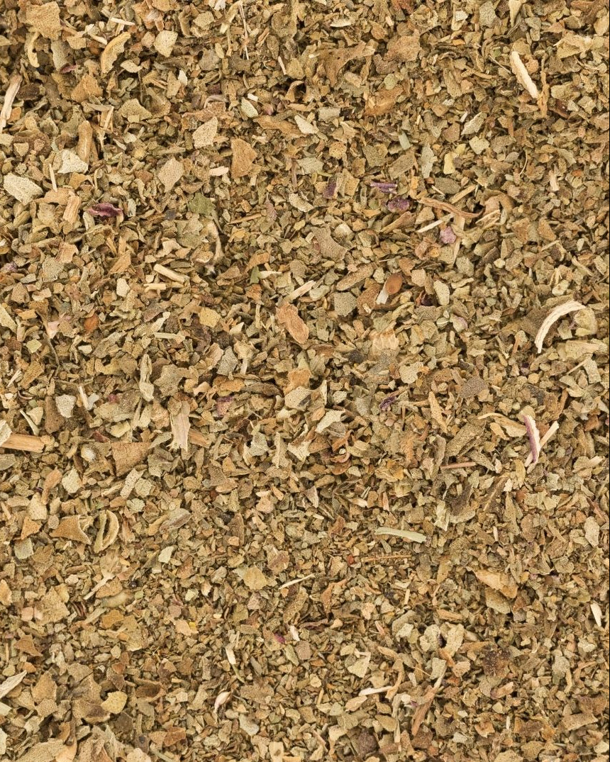 A close-up image of dried basil, showing the texture and color of the dried leaves.